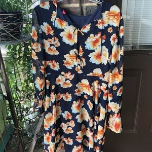 Beautiful sexy dress with flowers. Long sleeves.